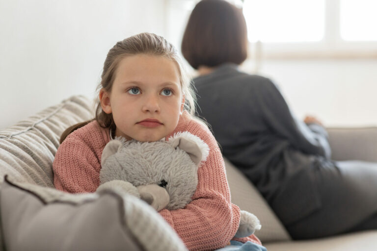 Unhappy cute teen daughter with toy ignores millennial caucasian woman in living room interior, close up. Quarrel, family, relationship problems, stress and parenting at home